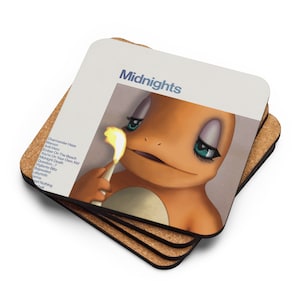 May include: A stack of square coasters with a cork base. The top coaster features a cartoon Charmander character with long eyelashes holding a lit match. The word "Midnights" is above the image, with a list of song titles on the left.