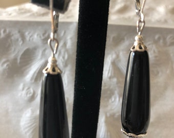 Black teardrop shaped glass bead earrings with silver plated accents