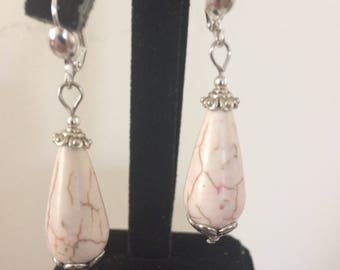 Ivory colored glass bead with brown enhancement earrings