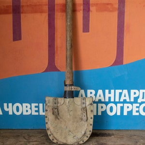 Vintage Army Shovel With a Leather Case