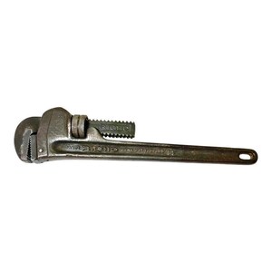May include: A vintage RIDGID pipe wrench with a 14-inch capacity. The wrench is made of metal and has a black finish. The wrench has a handle with a textured grip and a jaw with a serrated edge.