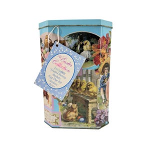 May include: A light blue hexagonal metal tin featuring vintage-style illustrations of chicks, bunnies, and flowers. A light blue tag attached with a white string reads: The Easter Collection Includes: Stuffed Bunny, Baskets, Egg Dye Kit, Stickers, Bows.