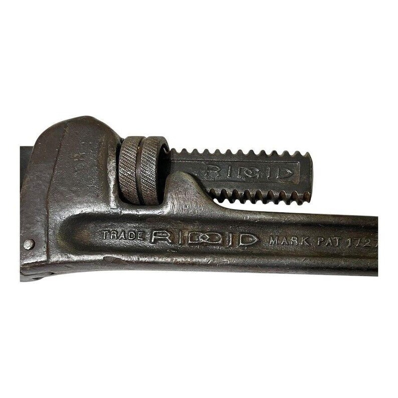 May include: A vintage RIDGID pipe wrench with a black finish and a serrated jaw. The wrench has a trade mark and the text "MARK PAT 172".