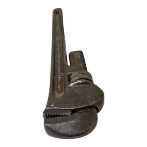 May include: A vintage, silver-toned pipe wrench with a black handle and the text "WILLIAMS ADJUSTABLE WRENCH 14" stamped on the side.