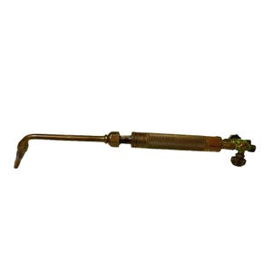 May include: A vintage brass welding torch with a textured handle and a curved nozzle. The torch has a series of valves and fittings, and is designed for welding or soldering. The torch is a golden color and appears to be well-used.