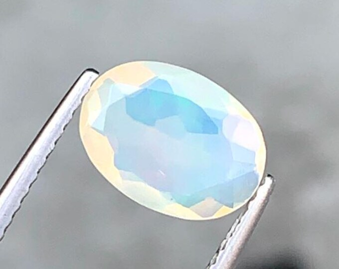 1.07 Carat Natural White Opal. Faceted Oval. 9.8 x 7.2 x 3.9 mm. Genuine Earth Mined. Untreated. Birthstone Gift. Loose Gemstones.