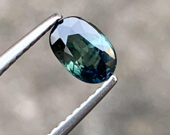 0.87 Carats Teal Sapphire. Oval Cut Natural and Genuine Mined. Precious Gems for Jewellery. Teal-Colour Sapphire. Heated. 6.5 x 4.4 x 3.1 mm