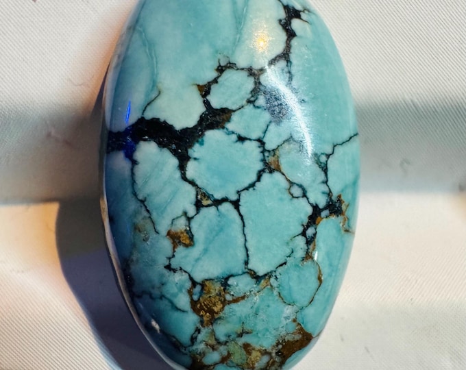 10.35 Carat Magnesite Loose Gemstone. 21.0 x 12.7mm. Treated. Loose Gemstone for Jewellery. Teal Blue Colour. Oval Cabochon. Treated