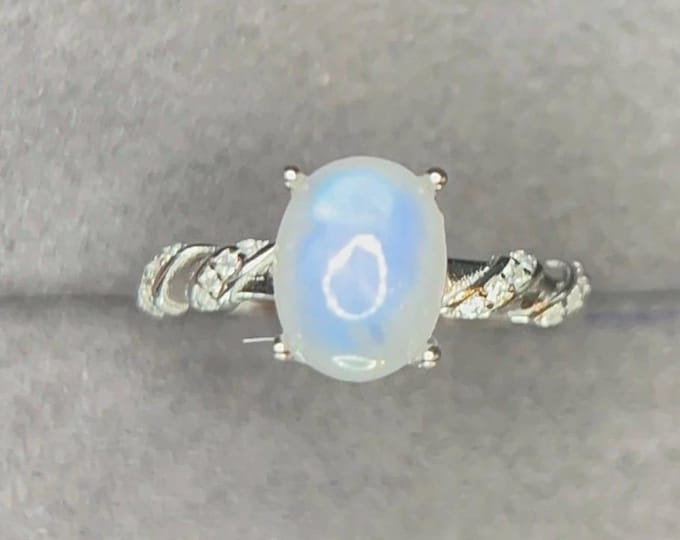 Lovely Natural White Moonstone 8.90 x 7.00 x 3.70 with White Zircon Shoulder Stones, Adjustable Ring. 925 Sterling Silver TCW 10.70 Carats