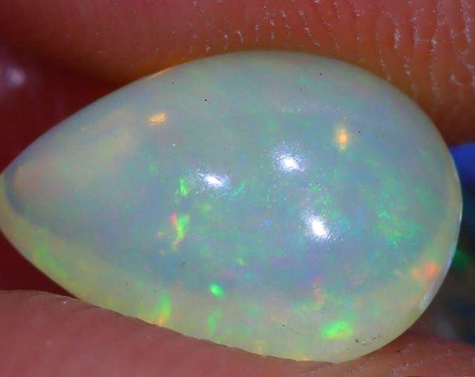 1.46 Carat Genuine Mined Flash Natural Ethiopian Welo Opal. 9.76 x 7.12 x 4.92 mm. Cabochon. Loose Gemstone. Birthstone. Jewelry Supplies.