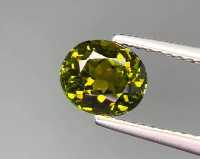 1.45 Carat Green Tourmaline. Faceted Oval Cut. Loose Gemstones for Jewelry. VS Grade. Genuine Mined. Natural Untreated. 7.3 x 6.4 x 4.90 mm.