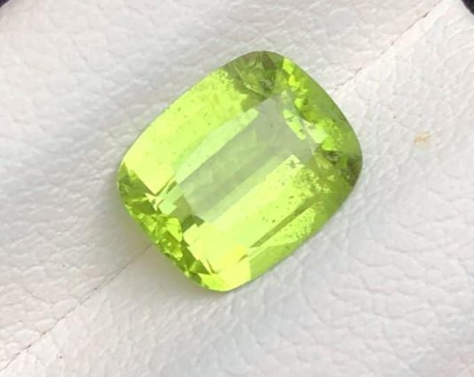 1.55 Carat Genuine Mined Peridot Faceted Loose Gemstone for Making Jewellery. Cushion Cut. 8 x 6.6 x 3.7 mm. Birthstone. Untreated. VS Grade