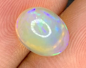 2.20 Carat Welo Opal. 10 x 6 x 8. Untreated. Gemstone Beads. "Unlevel" Cabochon. Birthstone Gift. Natural Gemstones. Oval Cab. Flash.