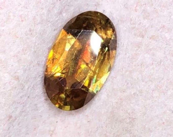 0.90 Carat Genuine Chrome Fire Sphene. Faceted Oval Cut. Loose Gemstones for Creating Jewellery. 8 x 5 x 3. Titanite. I Grade.