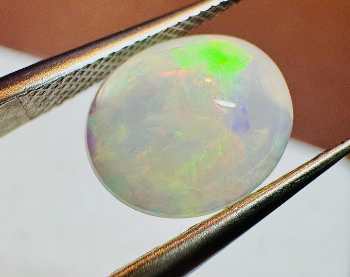 Genuine Mined 1.99 Carat Natural Ethiopian Welo Opal Cabochon.10.88 x 8.92 x 4.47 mm. Light Colouration. Oval. Loose Gemstone. Birthstone