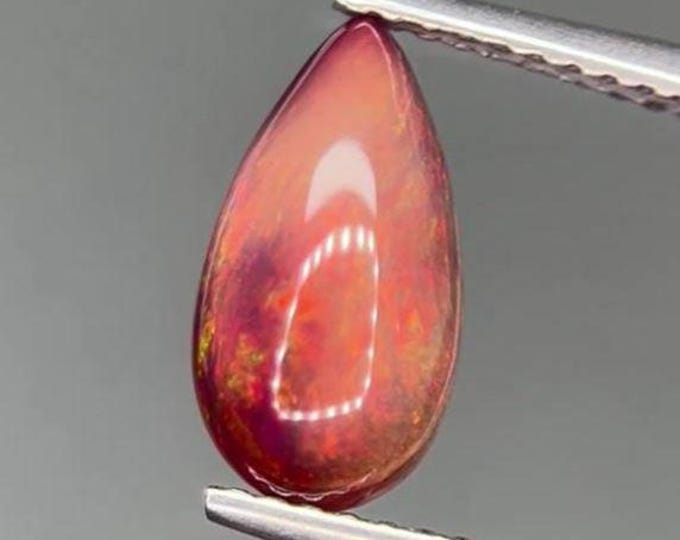 1.24 Carat Genuine Mined Ethiopian Chocolate Opal. Intense Colour Play. Opal Cabochon. Brown Opal for Jewellery. 11.4 x 6.2 x 3.8 mm.