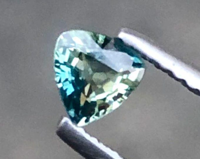 0.45 Ct Natural Teal Sapphire. Triangle Cut Genuine Mined. Precious Gems for Jewellery. Teal-Colour Sapphire. Heated. 4.70 x 4.70 x 2.50 mm