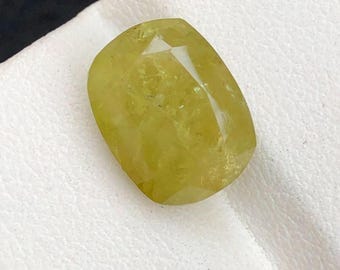 7.90 Carat Mali Garnet. Yellow Olive Faceted Gemstone. No Treatment. 12.4 x 9.4 x 7.7 mm. Earth Mined. Cushion Cut