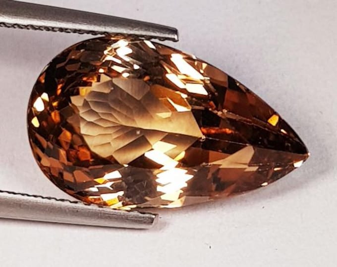 11.95 Ct Natural Champagne Topaz Gemstone. Loose Gemstones for Jewelry. VVS. 17.7 x 10.7 x 8.4 mm. Pear Cut. Heat Treated. Earth Mined.