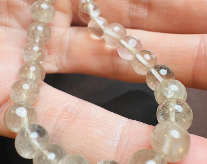 Clear Quartz Breads. 73 Carats. Polished Round Beads. White and Clear. 7mm. Bold Bracelet. 7 Inch Length Strand.