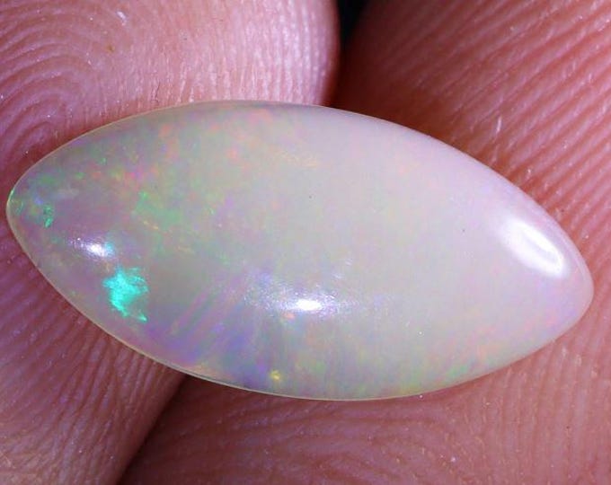 Genuine Mined 1.13 Carat Natural Ethiopian Welo Opal Cabochon. 13.89 x 6.6 x 2.4 mm. Light Colouration. Marquise. Loose Gemstone. Birthstone