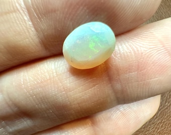1.15 Carat Natural Ethiopian Opal. Faceted Oval. Rainbow Flash Welo Opals. 8.3 x 6.2 x 4.3 mm. Genuine Earth Mined. Untreated.