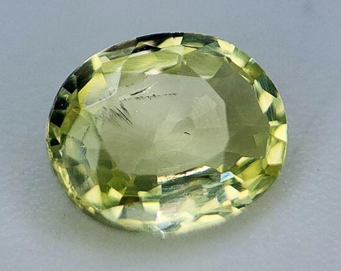 0.68 Ct Chrysoberyl Golden. Included Grade. Genuine Mined. Loose Gemstones for Making Jewelry. 6 x 5 x 2.5 mm. Untreated. Faceted Oval Cut.