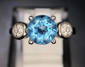 Lovely Natural Swiss Blue Topaz 7.8 x 7.8 x 6.0 Ring. Hallmarked 925 Sterling Silver. Ring Size 8. Total carat wt 17.00 or 3.51 grams.