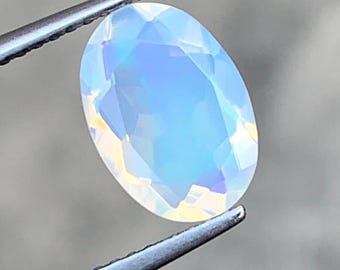 1.55 Carat Natural White Opal. Faceted Oval. 10.40 x 7.30 x 4.80 mm. Genuine Earth Mined. Untreated. Birthstone Gift. Loose Gemstones.