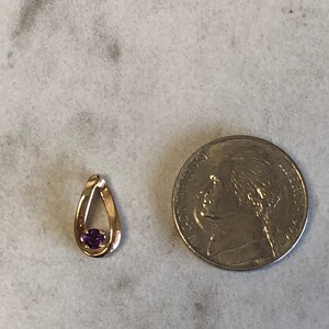 14kt Yellow Gold Lady&#39;s Round Amethyst Pendant in a Fashionable Mounting. FREE SHIPPING on this item.