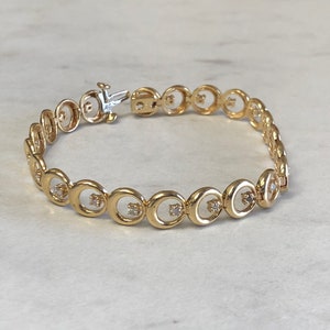 14kt massief geelgouden damesdiamanten cirkel 7" fashion statement-armband tegen een zeer betaalbare prijs.