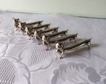 Set aus sechs versilberten Katzenmesserablagen