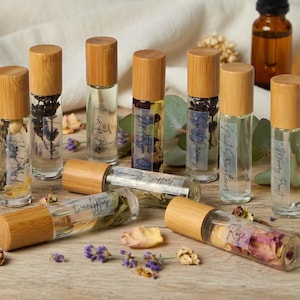 All natural essential oil roller collection with rose lavender eucalyptus immunity support and mood blend rollers handmade with dried botanicals