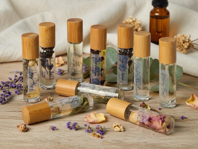 All natural essential oil roller collection with rose lavender eucalyptus immunity support and mood blend rollers handmade with dried botanicals