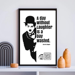 May include: Framed black and white print featuring Charlie Chaplin in a bowler hat and mustache. The print displays the quote "A day without laughter is a day wasted." and a QR code for scanning.