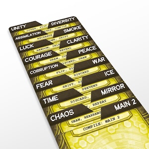 May include: A close-up of a stack of game cards with a yellow and brown color scheme. Each card is labeled with a word such as "Unity", "Diversity", "Chaos", and "Time". The cards have a geometric design.