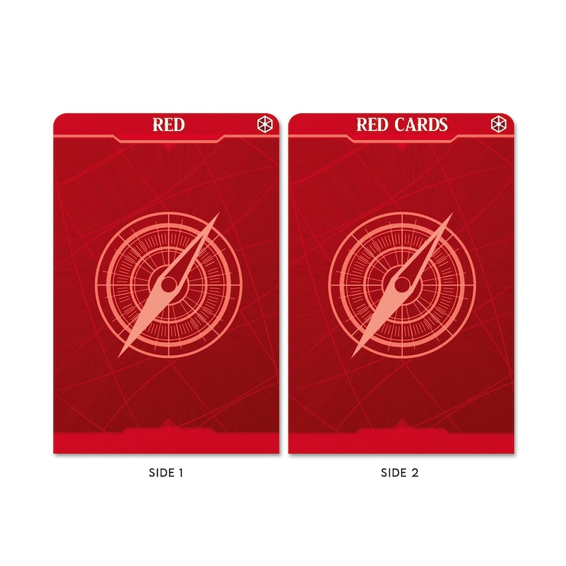 May include: Two red playing cards with a compass design. The front of the card says "RED" and the back of the card says "RED CARDS".