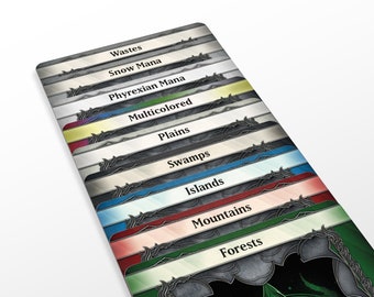 May include: A set of Magic: The Gathering land cards, featuring different colors and names, including Wastes, Snow Mana, Phyrexian Mana, Multicolored, Plains, Swamps, Islands, Mountains, and Forests.