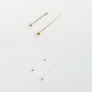 May include: Two pairs of head pins, one pair is gold and the other is silver. The pins are different lengths.