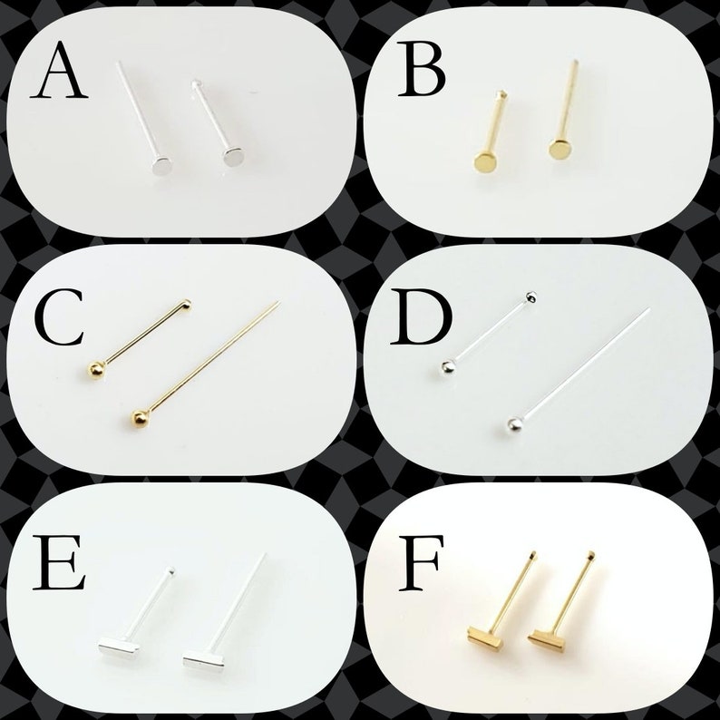 May include: Six different styles of nose rings. The nose rings are made of silver and gold. The nose rings are labelled A through F.
