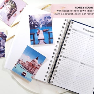 May include: A blue and white planner with a silver spiral binding. The planner is open to a page titled "Prospective Honeymoon" with sections for four different honeymoon options. The planner has space to note down important details such as budget, hotel, car rental and flights.