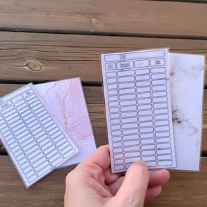 Set of mini A7-sized laminated budget trackers for A7-sized zipped budget envelope