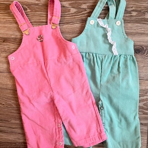 Vintage baby overalls corduroy dungarees, two pair in aqua and pink with lace and floral details, 0-6 month size