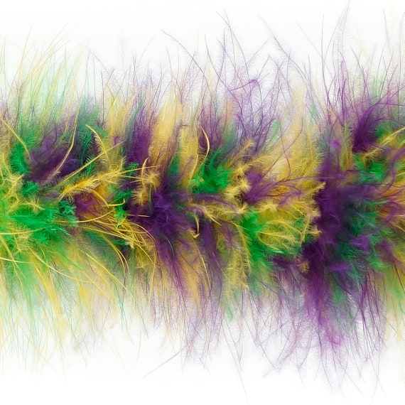 Full frame background of Mardi Gras feather boa and beads Stock