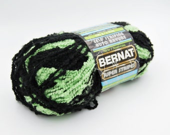 Bernat super stripes self striping yarn, black and lime green boucle yarn, bulky weight 5 yarn