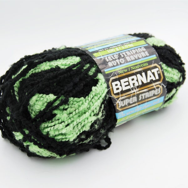 Bernat super stripes self striping yarn, black and lime green boucle yarn, bulky weight 5 yarn