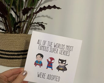 All of the Worlds most famous Super Heroes were adopted card