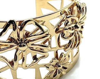 Pulsera ancha geométrica floral 3D dorada de Nina Ricci de Avon