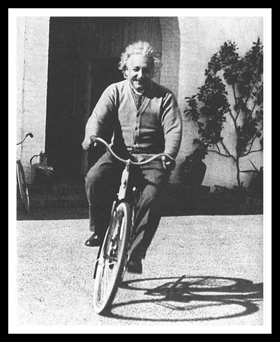 einstein riding a bicycle