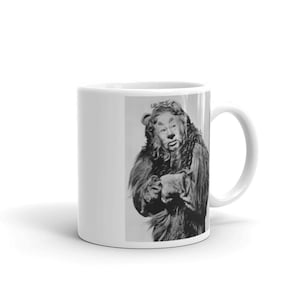 May include: A black and white photo of the Cowardly Lion from the Wizard of Oz. The lion is wearing a fur coat and has a worried expression on his face.